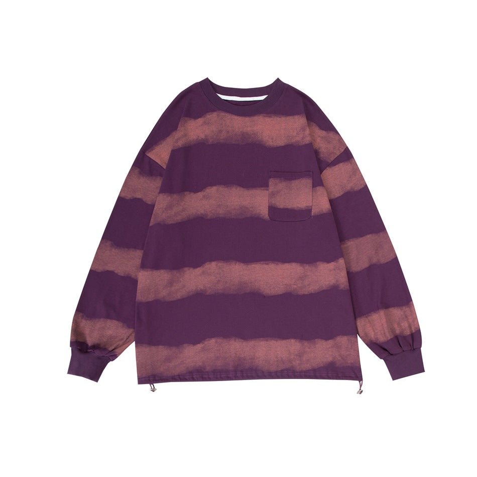 Purple long-sleeve crew-neck top with faded dusty pink horizontal stripes, chest pocket and drawcord hem, flat front view