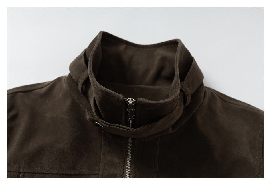 Close-up of the jacket's high stand collar, adjustable strap and front zipper.