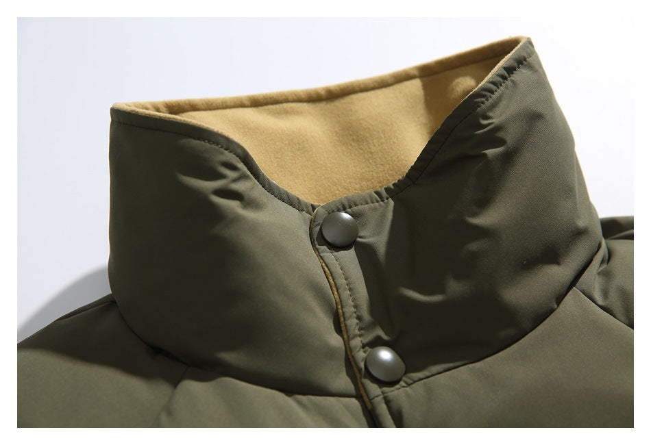 Close-up of the jacket's tall olive collar, tan fleece-like lining, and two front snap buttons.