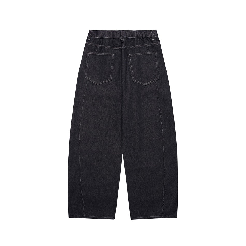 Back view of dark wide-leg jeans with two patch pockets, an elasticated waistband and contrast stitching.