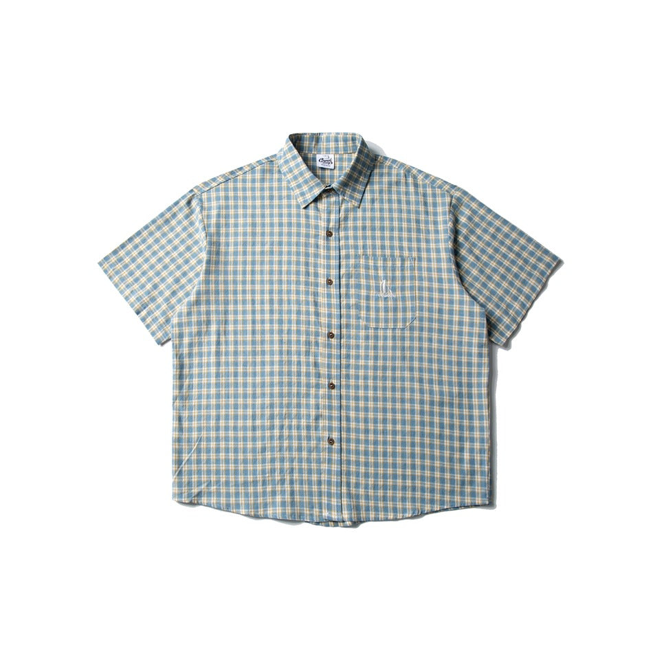 Light blue and cream plaid short-sleeve button-up shirt with chest pocket, flat lay front view