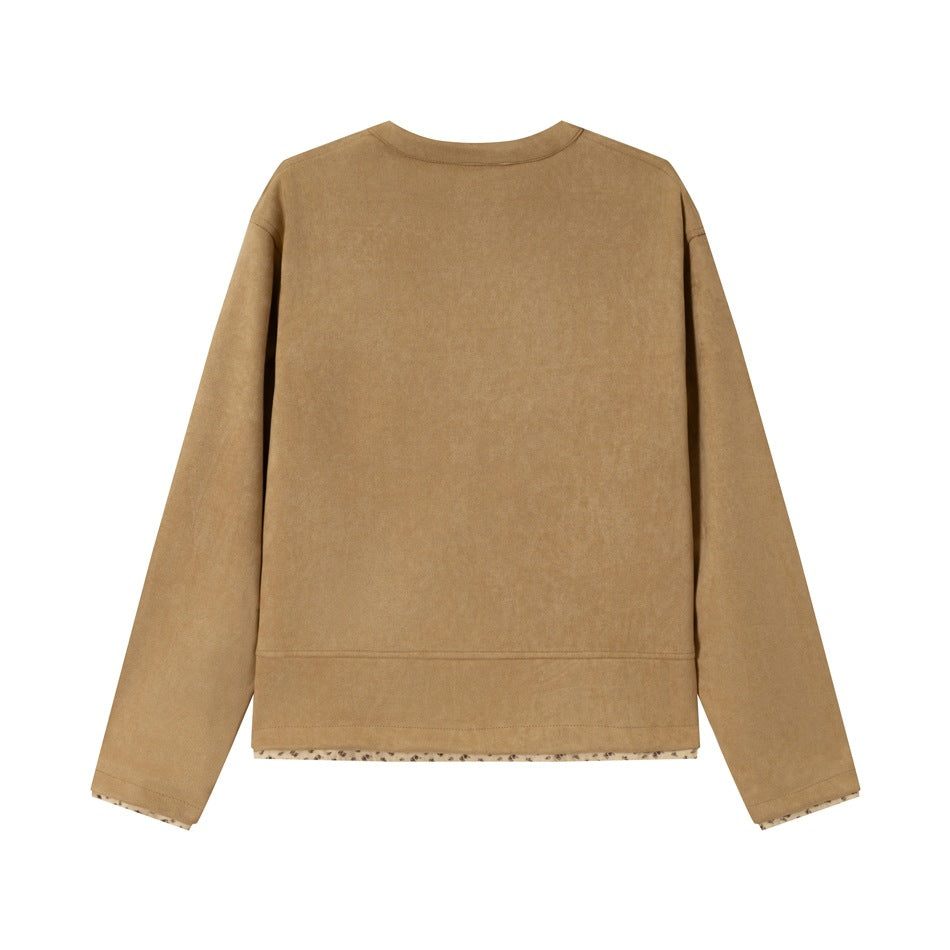 Back view of a plain tan long-sleeve jacket with a rounded neckline and a narrow floral-print hem trim.