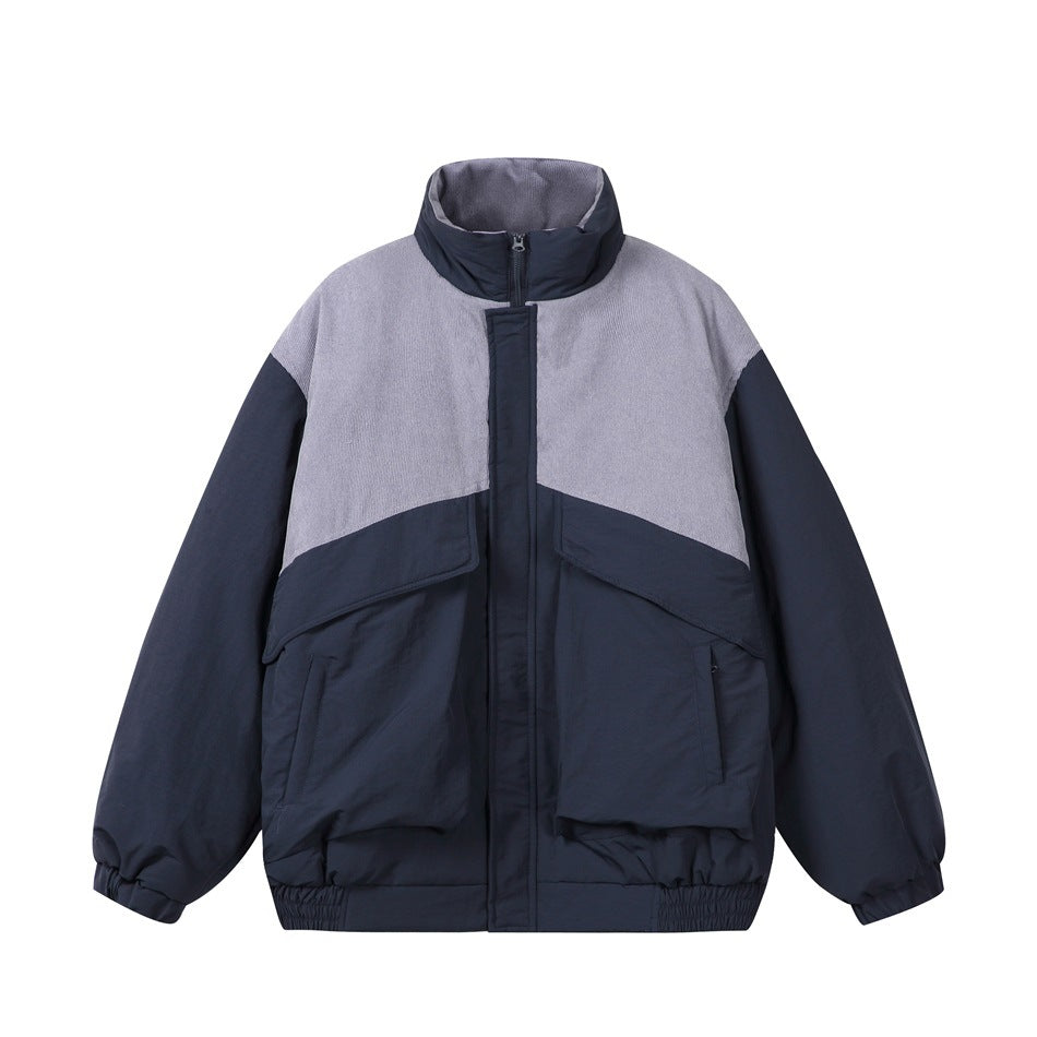 Navy padded stand-collar jacket with gray-lavender textured upper panel, front zip and large flap pockets, front view