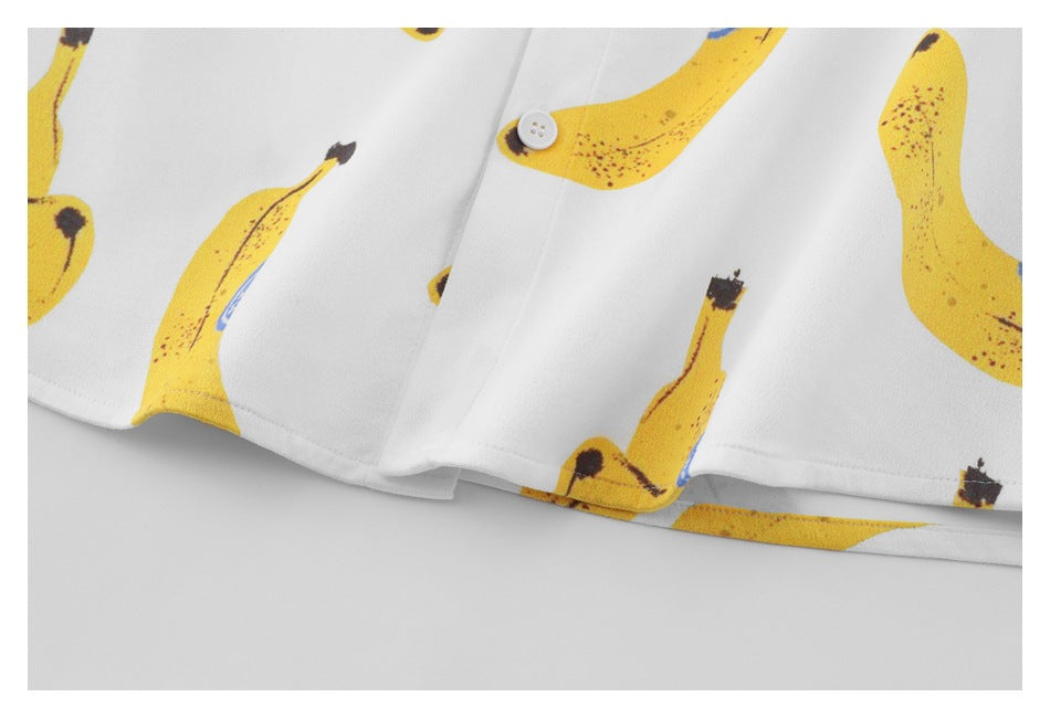 Close-up of the white shirt's hem and yellow banana print.