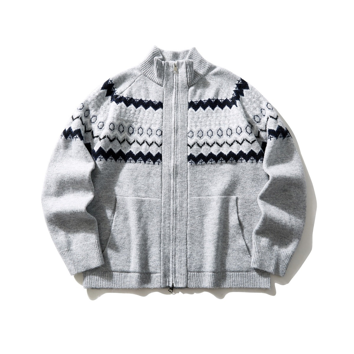 Gray zip-up knit cardigan with stand collar, navy and white Fair Isle pattern across the chest, front pockets, flat lay
