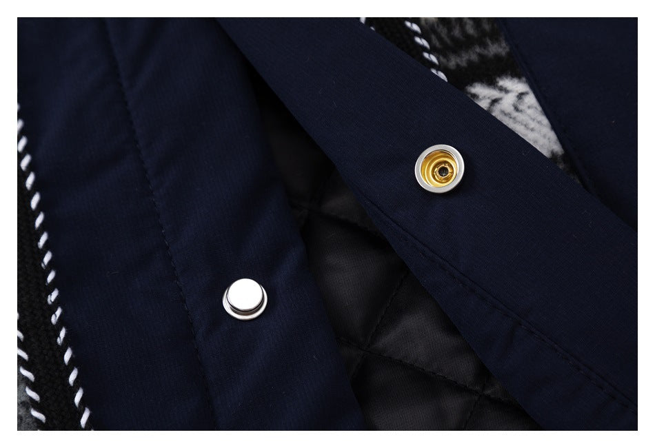 Close-up of silver and gold-tone snap fasteners on the navy front placket, with plaid fabric nearby.