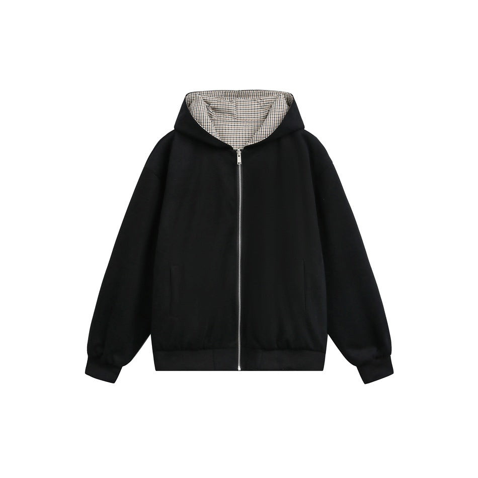 Black zip-up hooded jacket flat lay with brown and cream check hood lining, ribbed cuffs and hem