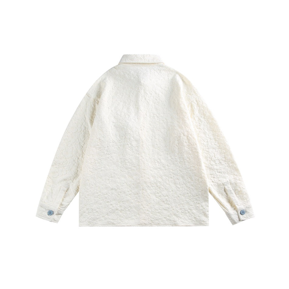Back view of an ivory textured jacket with a plain back and buttoned cuffs.