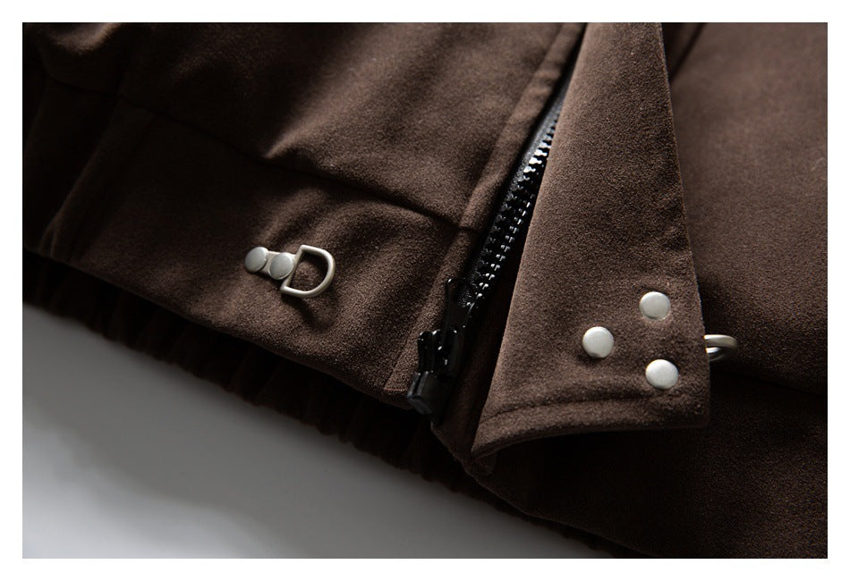 Close-up of a brown coat's zipper, snap-fastened flap, and metal hardware.