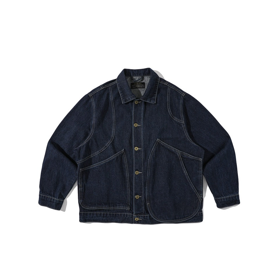 Dark indigo denim jacket flat lay, front view with button front, curved panels and large curved pockets