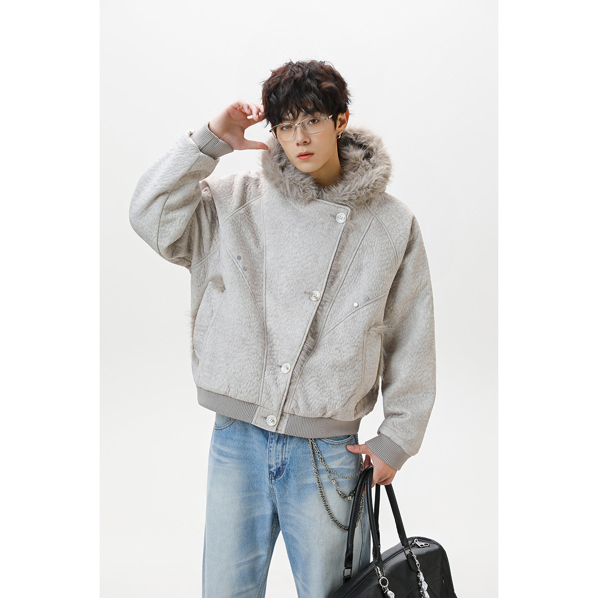 Model wearing a light gray quilted jacket with a large faux-fur collar, ribbed trim, and diagonal button front.