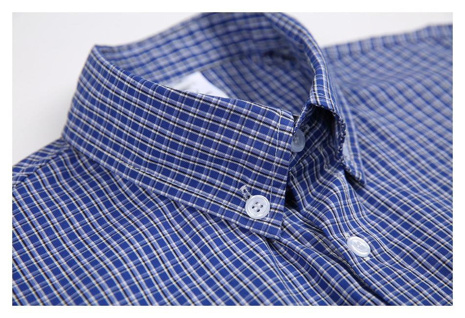 Close-up of a blue-and-white checked shirt collar with white buttons.