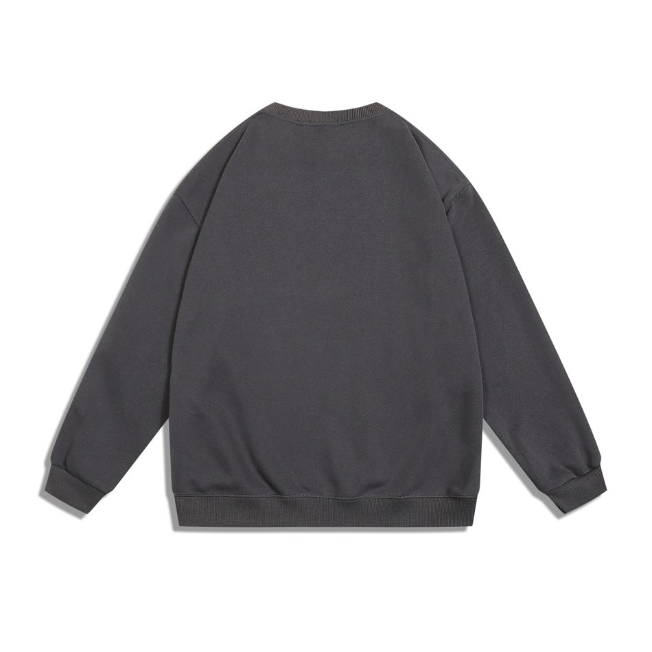 Back view of a plain charcoal gray crewneck sweatshirt with long sleeves and ribbed cuffs and hem.