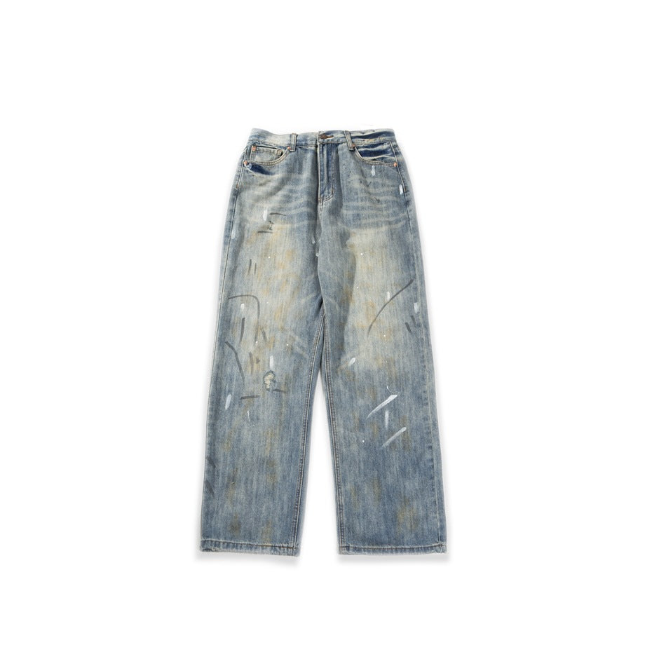 Light blue washed straight-leg jeans with faded distressed finish and paint splatter, flat front view