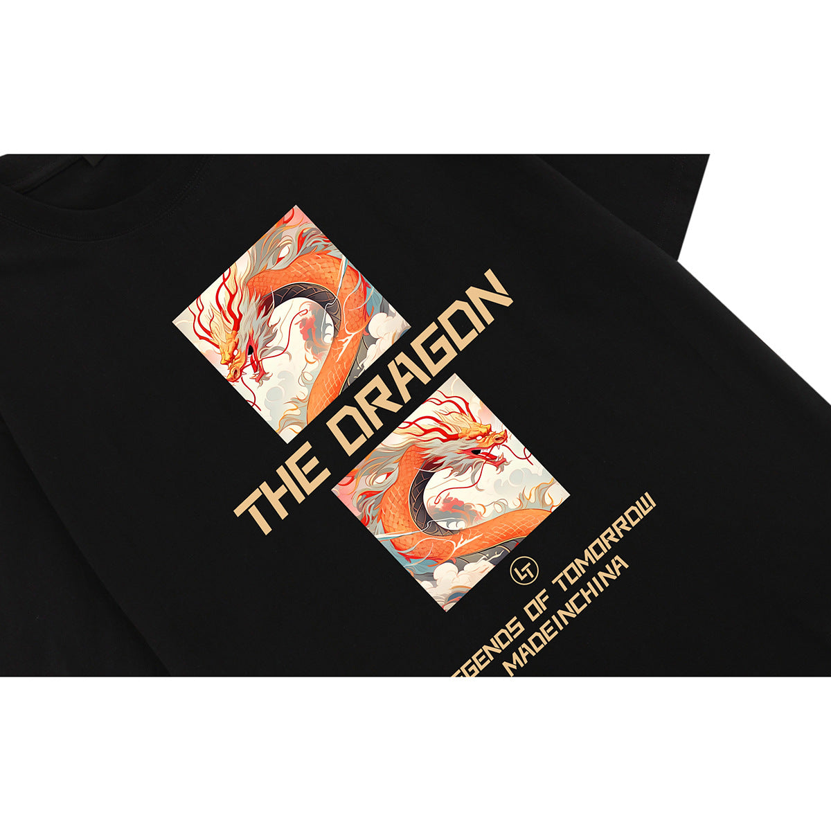 Close-up of a black T-shirt with an orange dragon graphic and tan lettering.