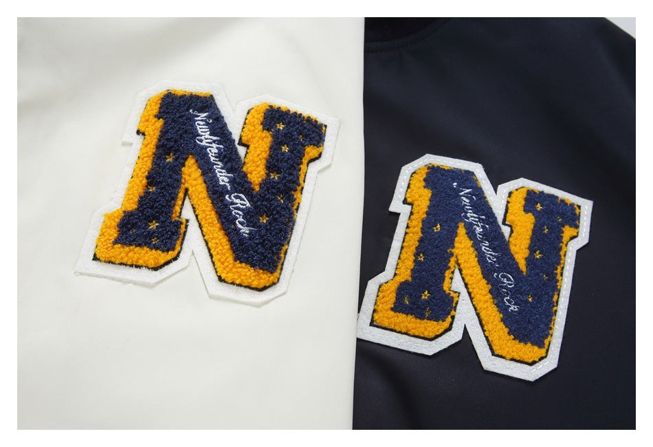 Close-up of matching navy-and-yellow chenille N patches on white and dark navy garments.