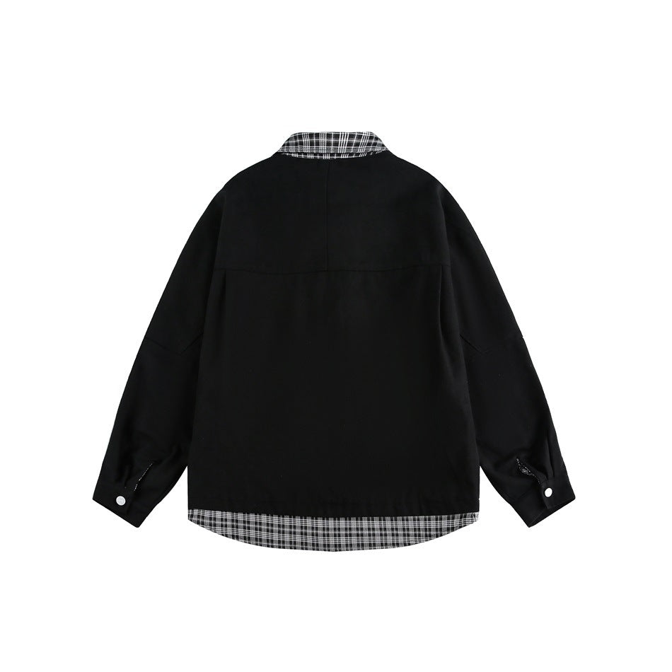 Back view of a black oversized jacket with a black-and-white plaid collar and hem and buttoned cuffs.