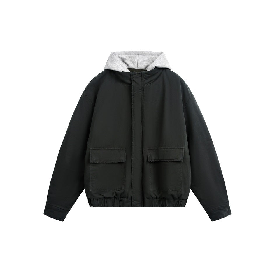 Dark green-black hooded jacket with gray hood layer, flap pockets and elastic hem, front view on white
