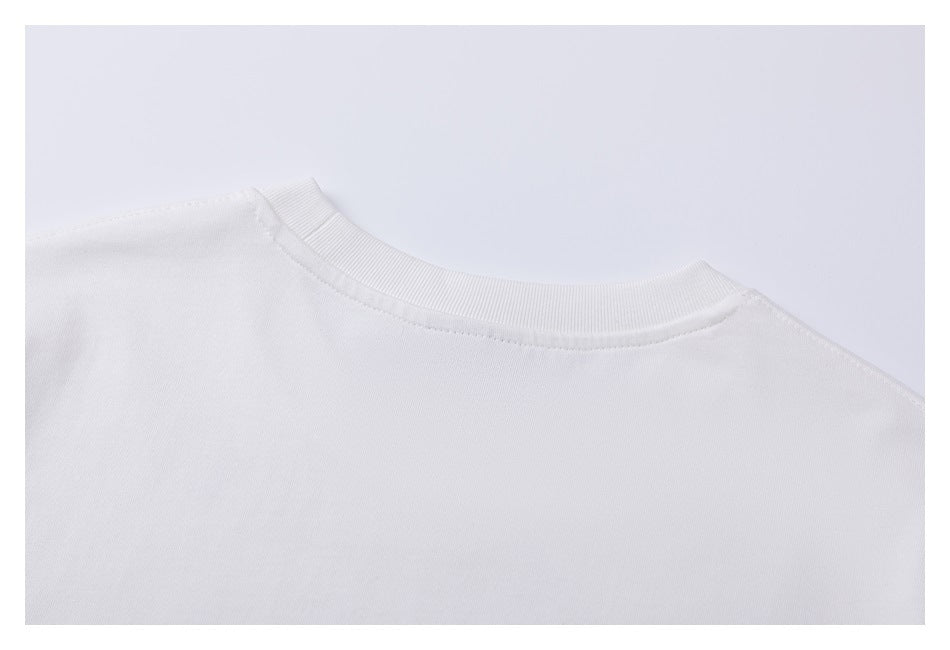 Close-up of the plain white back neckline and shoulder area of the T-shirt.