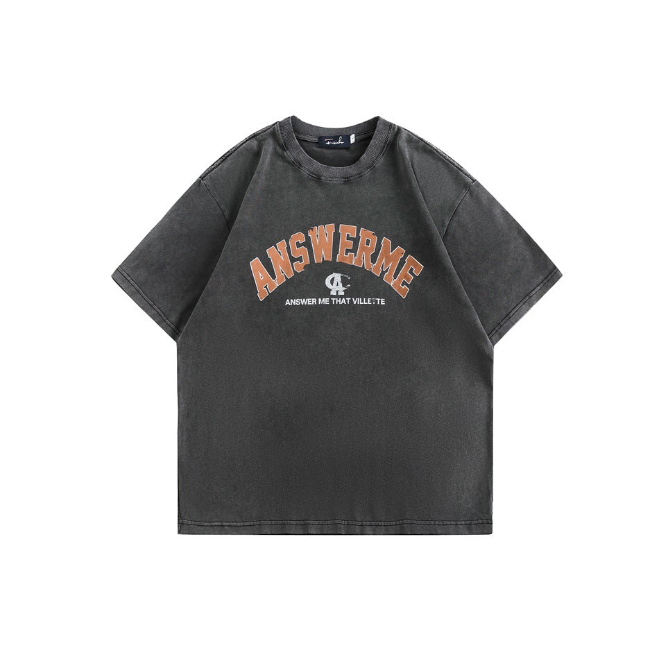 Washed black short-sleeve crew-neck T-shirt with orange ANSWERME arched chest graphic, flat front view