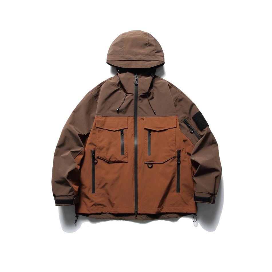 Reddish brown and rust color-block hooded jacket, front view, with flap chest pockets and zip pockets