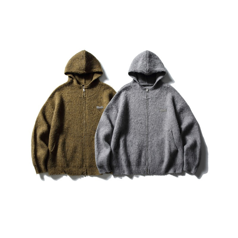Two zip-front hooded sweaters laid flat, one olive brown and one gray, shown from the front.