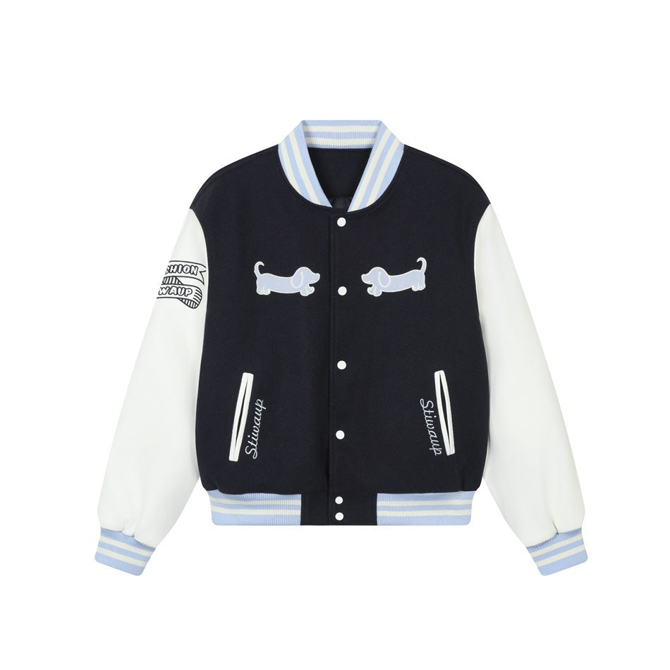 Navy varsity jacket with white sleeves, light blue striped trim, snap front and two dachshund appliqués, shown flat