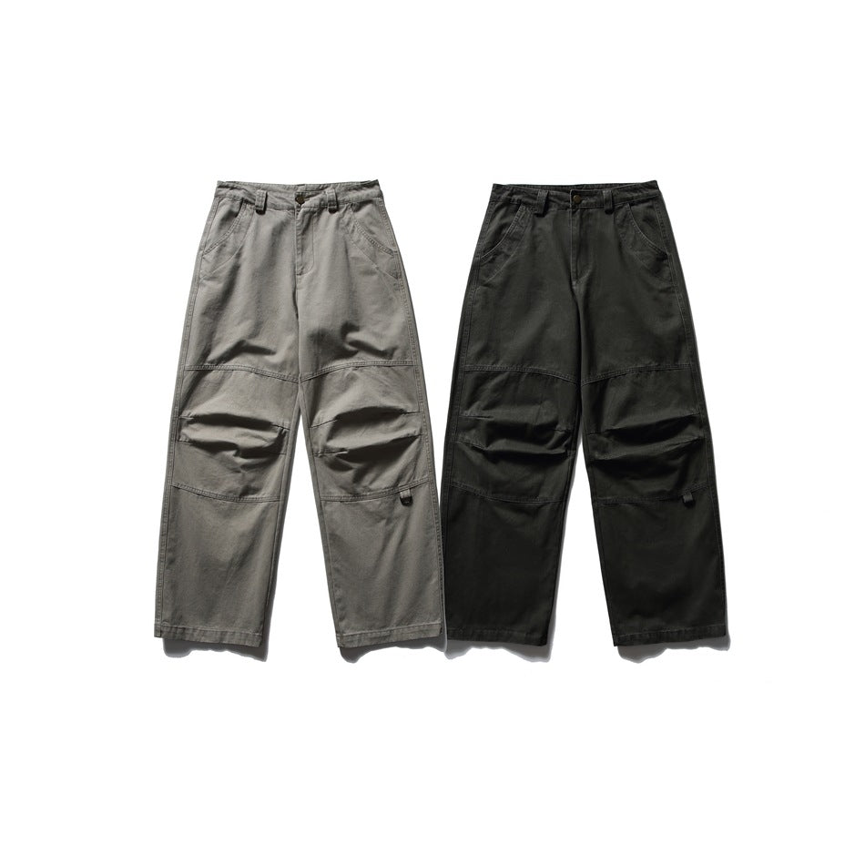 Two pairs of straight-leg work pants shown from the front in gray and black, with reinforced knees.