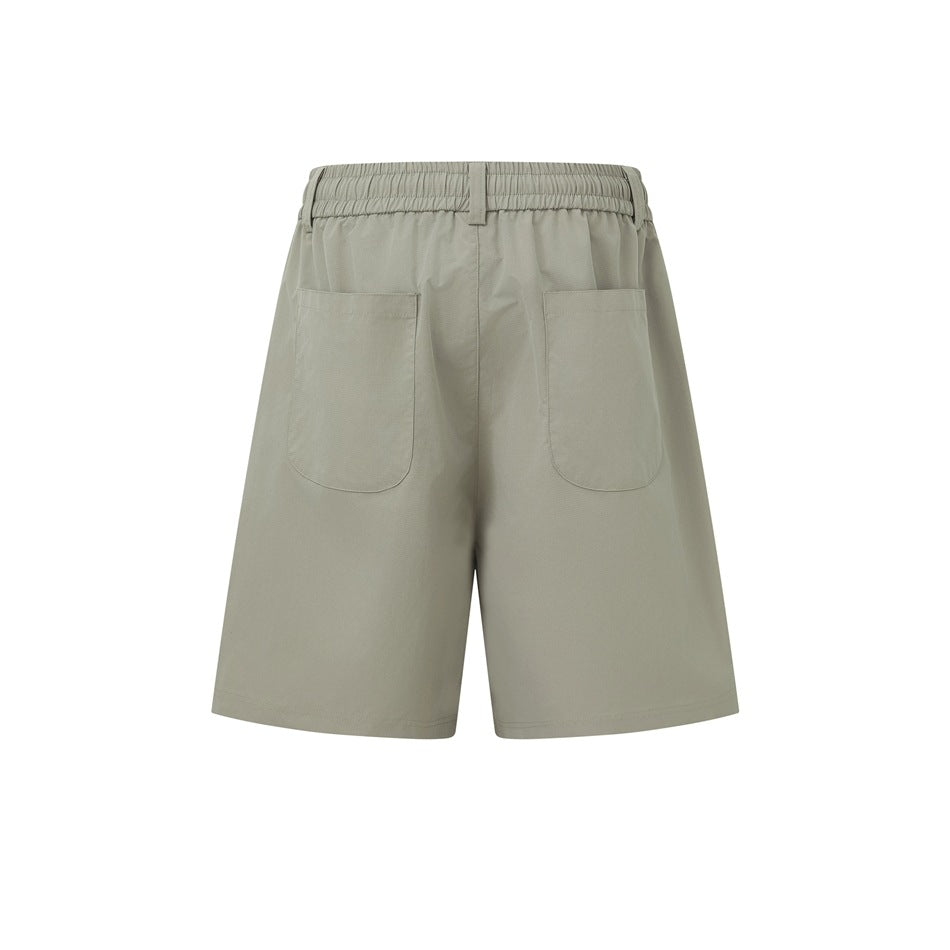 Back view of light gray-green shorts with an elastic waistband, belt loop, and two patch pockets.