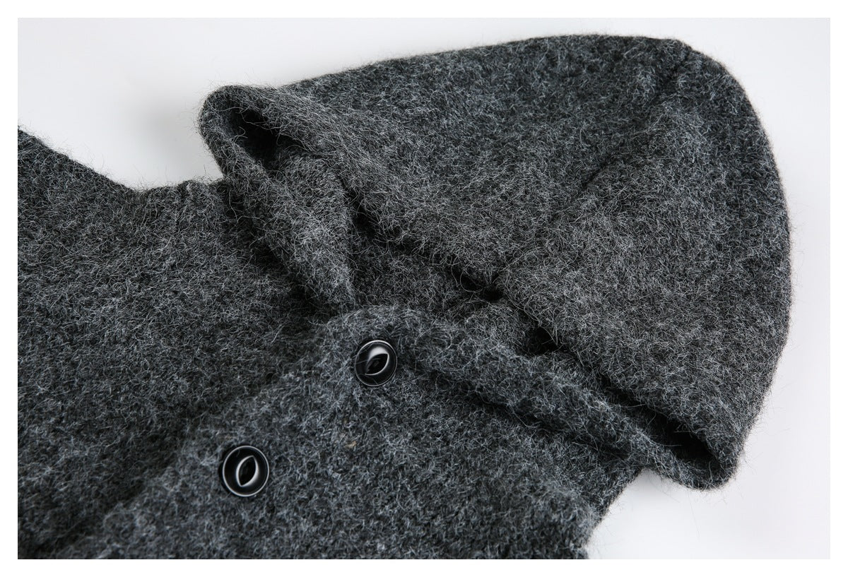 Close-up of the charcoal cardigan's hood, textured knit, and black buttons.