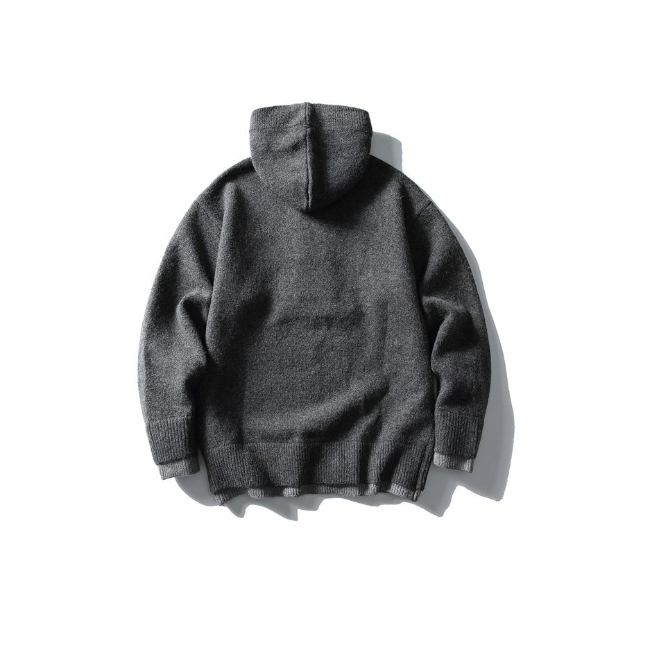 Back view of dark gray hooded knit sweater with ribbed hem and cuffs, flat lay