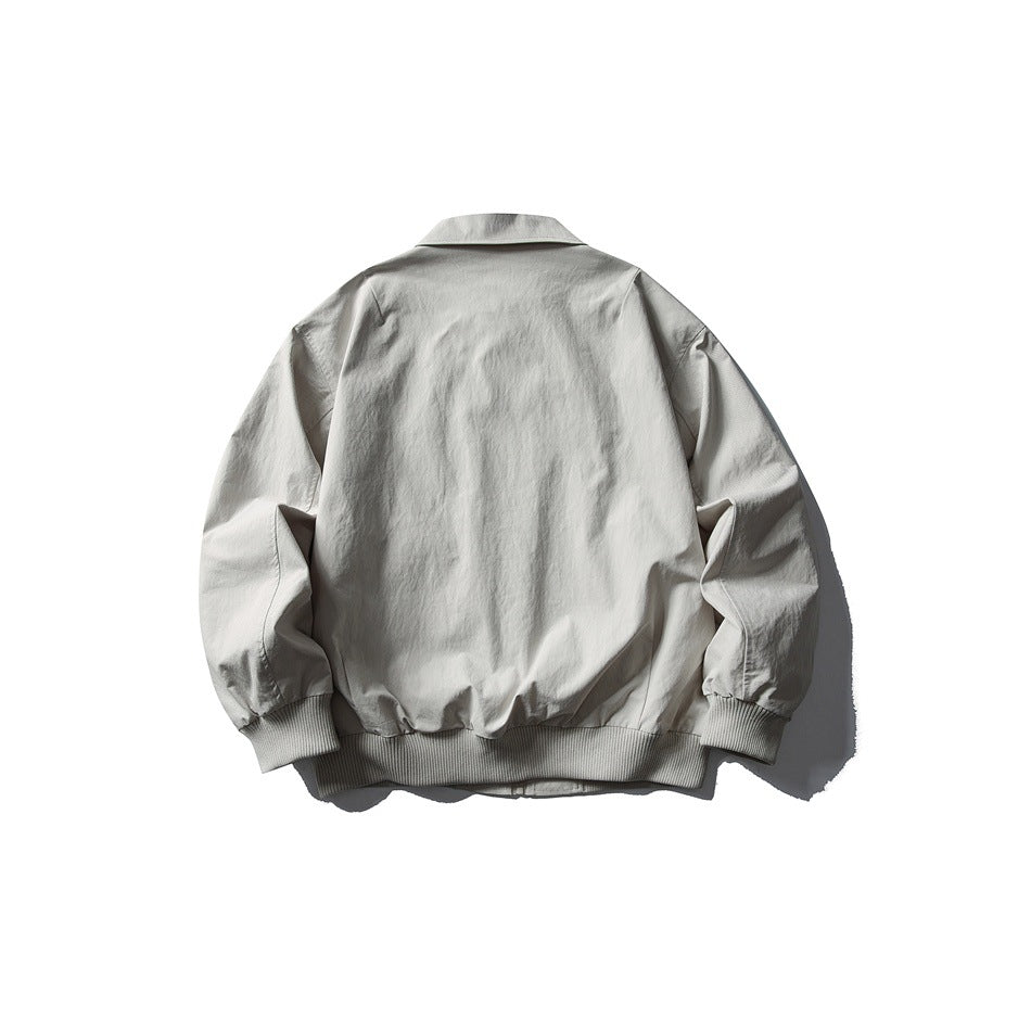 Back view of a light gray collared jacket with long sleeves and ribbed cuffs and hem.