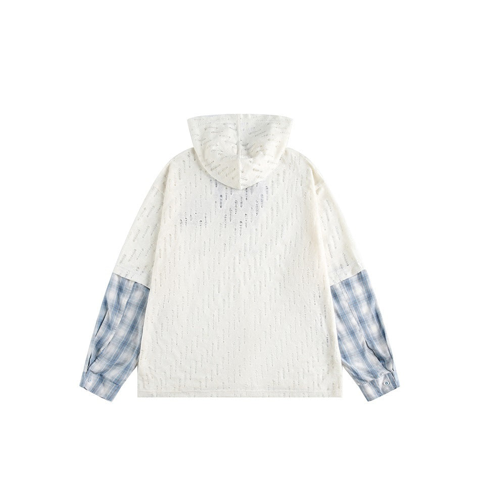Back view of an ivory hooded top with subtle vertical texture and blue plaid shirt-style sleeves.
