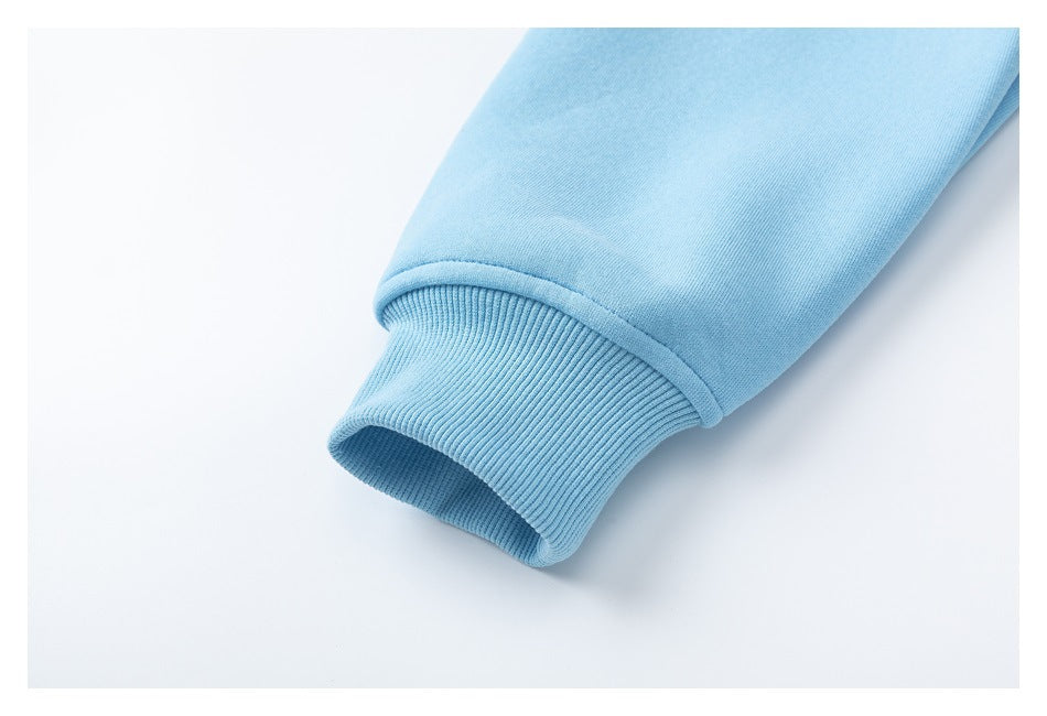 Close-up of a light blue sleeve ending in a ribbed knit cuff.