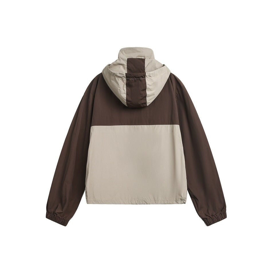Back view of a hooded jacket with dark brown sleeves and upper body, beige lower panel, and beige hood.