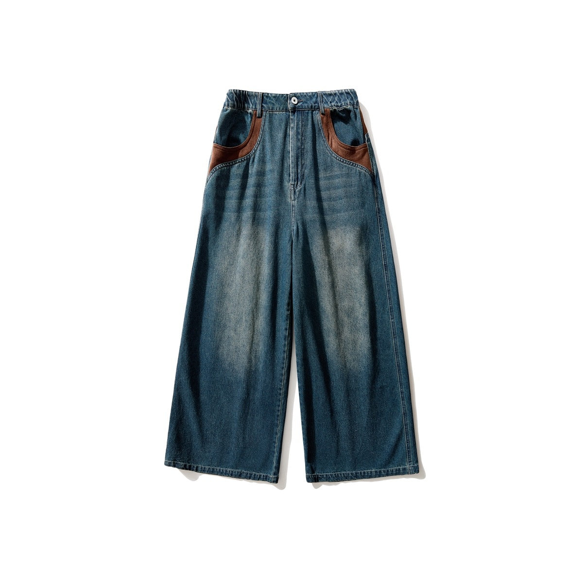 Front view of washed blue wide-leg jeans with brown contrast pocket trim, button closure and faded thigh wash