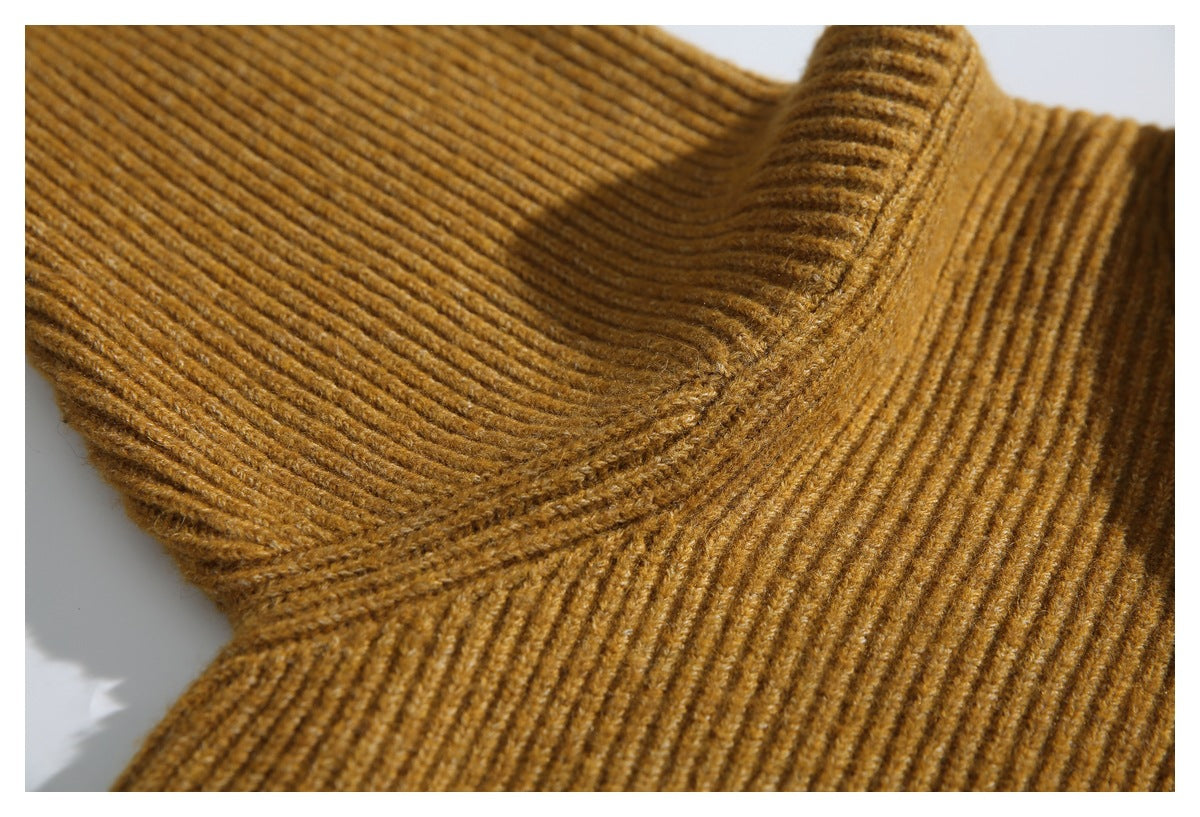 Close-up of a mustard-brown ribbed knit cardigan neckline and collar.