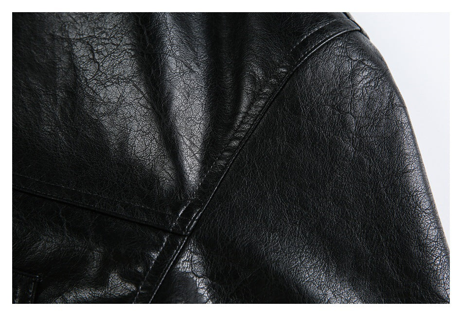 Close-up of the jacket's black shoulder and sleeve seam stitching.