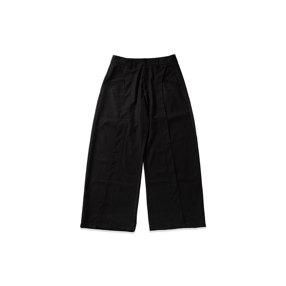 Black wide-leg trousers laid flat, front view, with button waistband, front pockets and vertical seam panels