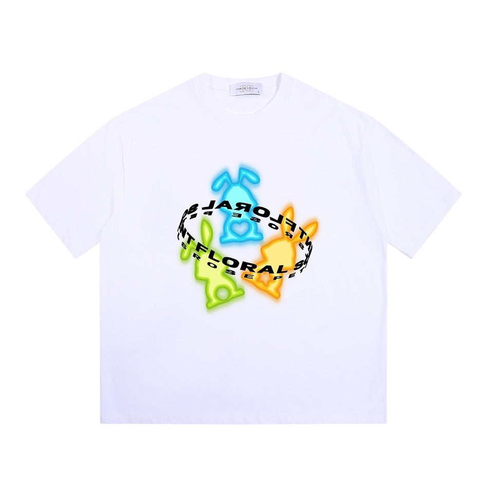 White short-sleeve crew neck T-shirt with a neon blue, green and orange rabbit graphic and curved lettering ring