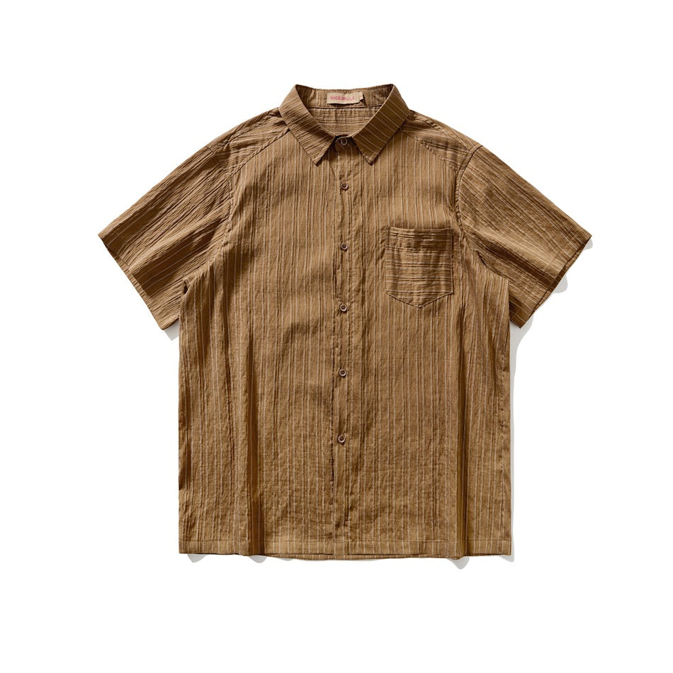 Brown short-sleeve button-up shirt with chest pocket and crinkled pinstripe texture, flat lay front view