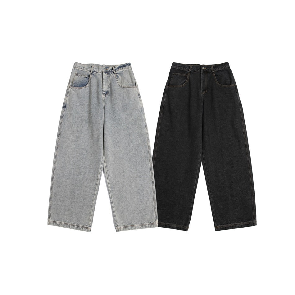 Two pairs of wide-leg jeans shown from the front, one light gray and one black.