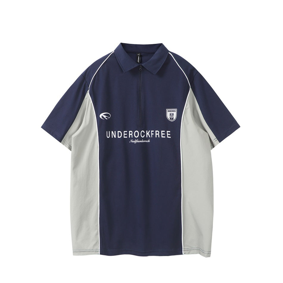 Navy short-sleeve quarter-zip polo with light gray side panels, white piping and white chest print, front view