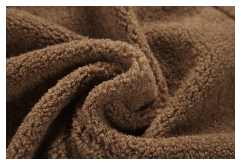 Close-up of brown curly-textured fabric gathered into a fold.