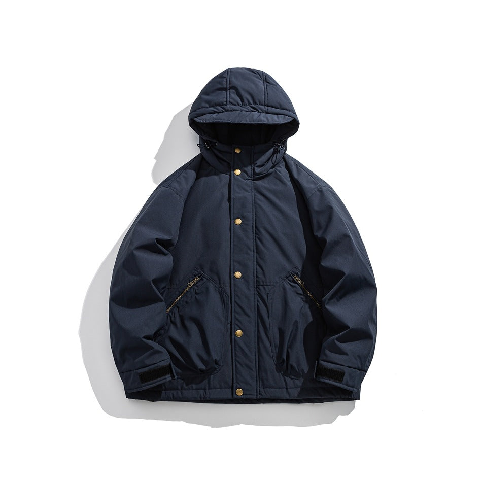 Navy blue hooded padded-look jacket, front flat view with snap buttons, zip pockets and cuff tabs