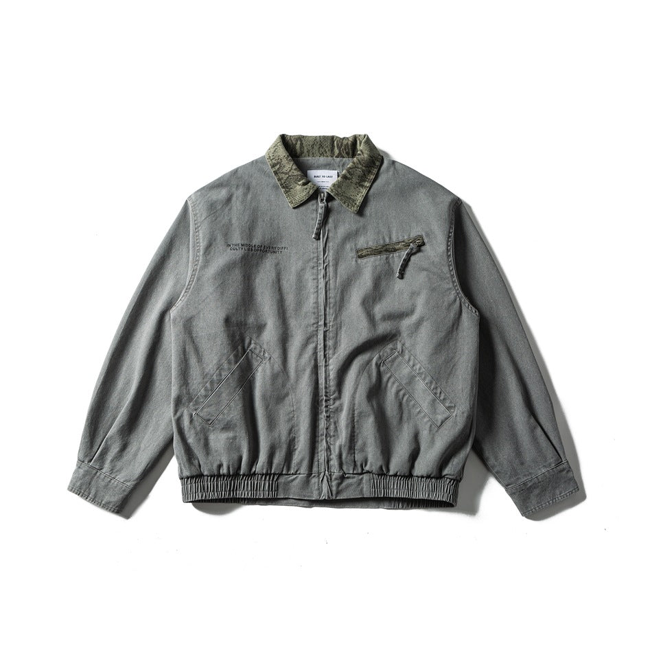 Washed gray zip jacket flat lay with green textured collar, chest zip pocket, slanted front pockets and elastic hem