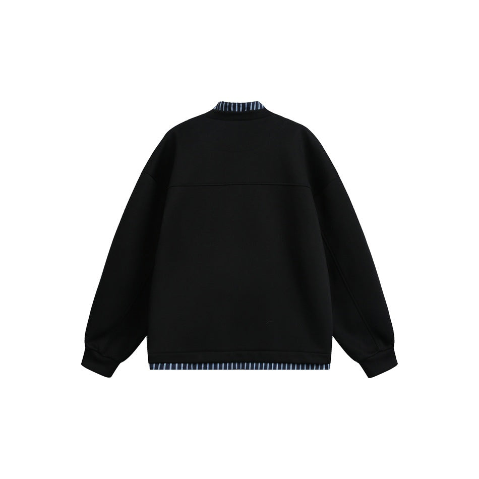 Back view of a black jacket with dropped shoulders, roomy sleeves, and striped trim at the collar and hem.