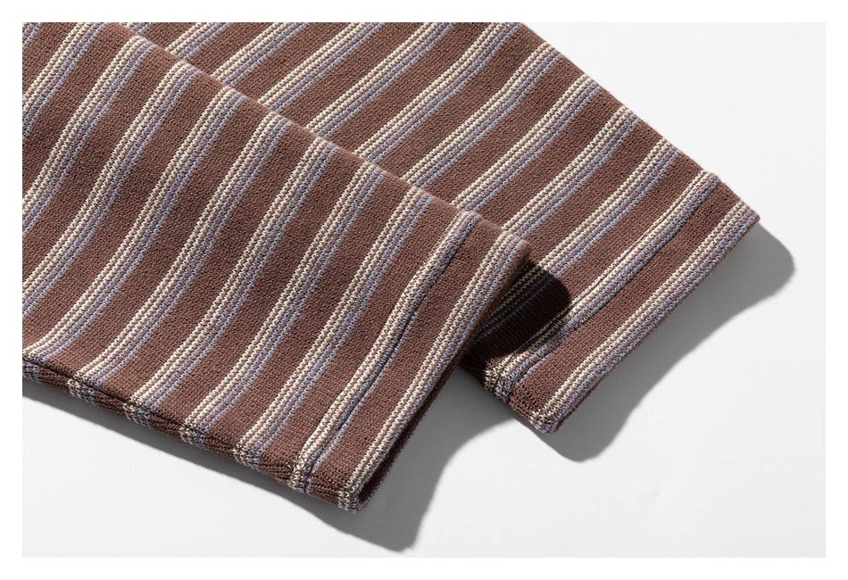 Close-up of the brown striped knit shirt's sleeve cuff and seam.