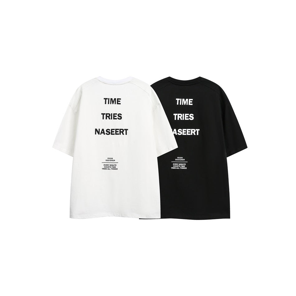 Back views of white and black oversized T-shirts, each with large stacked lettering and smaller text below.