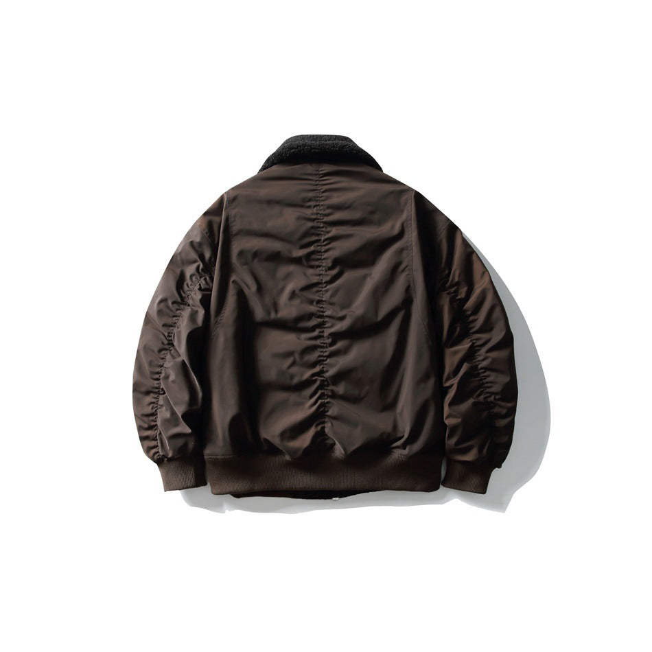 Back view of a dark brown bomber jacket with a black textured collar and ribbed cuffs and hem.